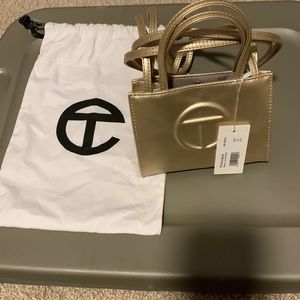 Unused small Telfar tote in Gold with dust bag